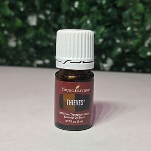 Young Living Thieves Essential Oil - Brown and White